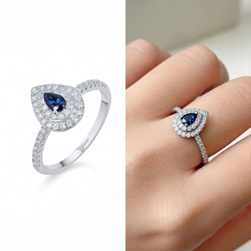 טבעת כסף עם אבן כחולה בצורת טיפה ושיבוץ זרקונים לנשים